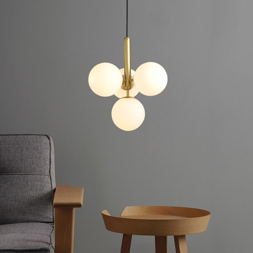 Suspension design laiton 4 sphères verre blanc chic élégant moderne