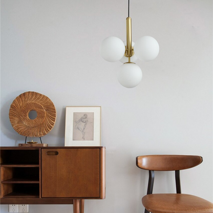 Suspension design laiton 4 sphères verre blanc chic élégant moderne