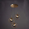 Suspension 3 Globes Design Contemporain Noir et Or – Luminaire Salon Maroc