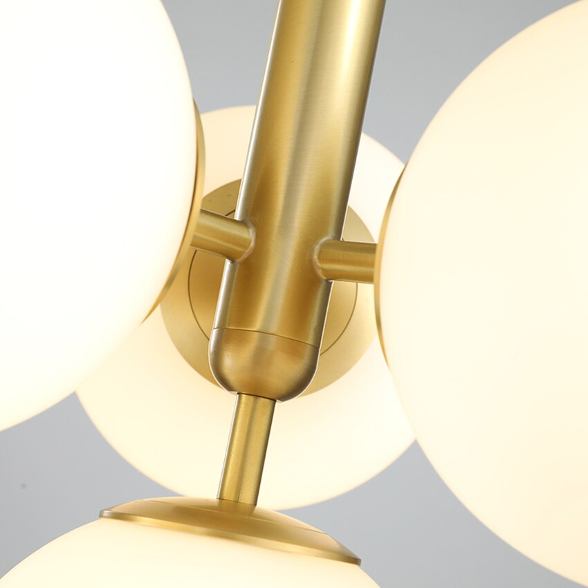 Suspension design laiton 4 sphères verre blanc chic élégant moderne