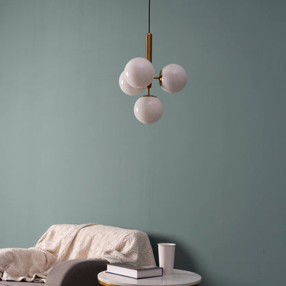 Suspension design laiton 4 sphères verre blanc chic élégant moderne